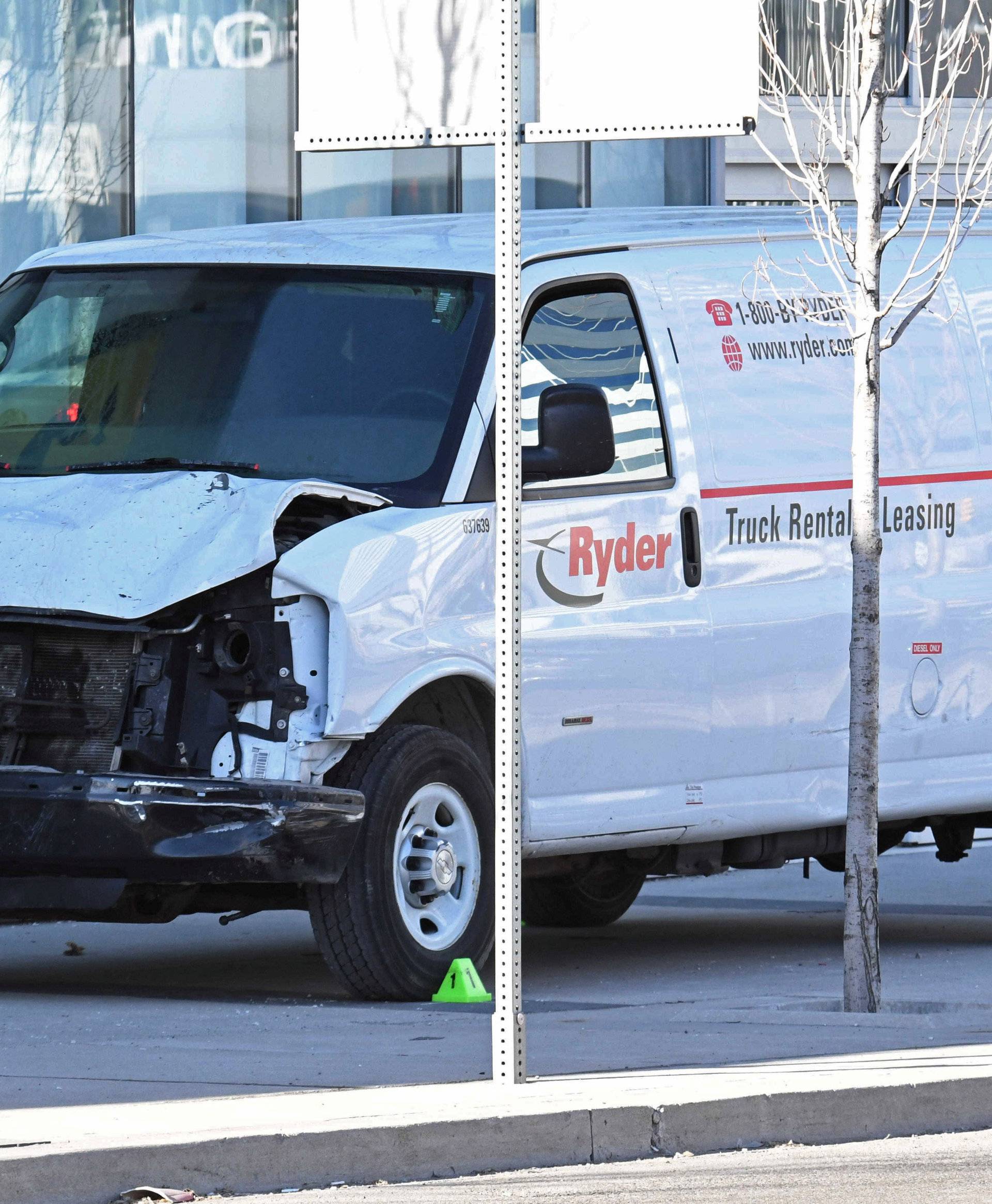 A damaged van seized by police is seen after multiple people were struck at a major intersection northern Toronto