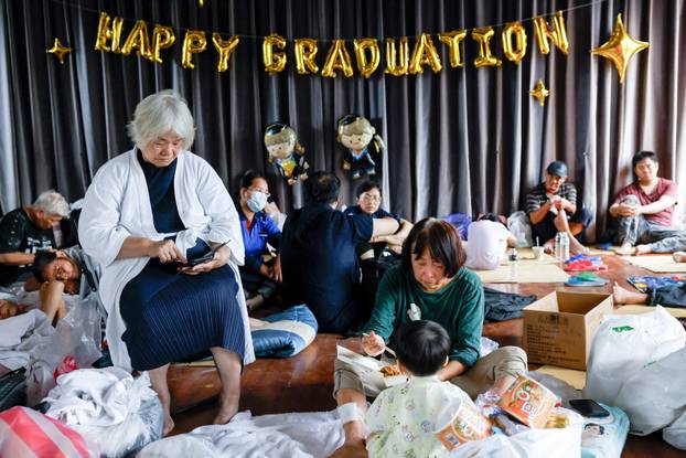People take shelter inside an elementary school after Super Typhoon Ragasa in Hualien