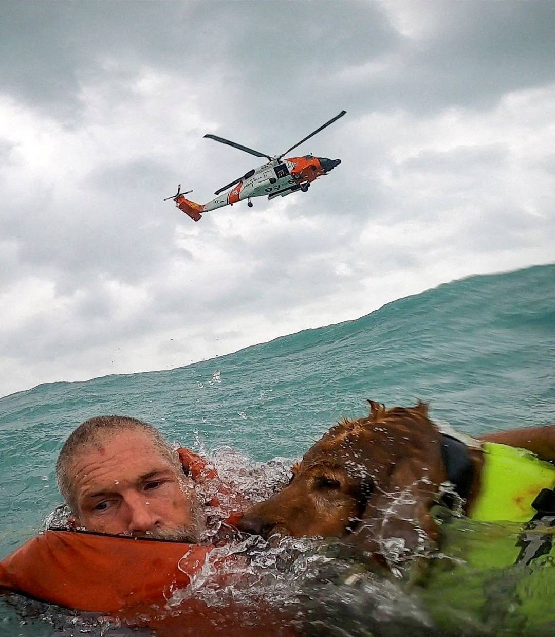 A U.S. Coast Guard Air Station crew rescues a man and his dog during Hurricane Helene after his sailboat became disabled and started taking on water off Sanibel Island