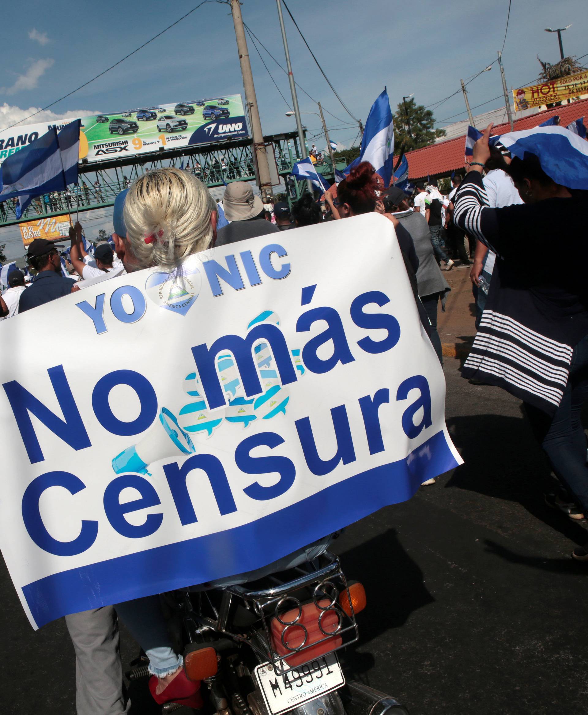 A demonstrator holds a banner reading "No more censorship" during a protest against police violence and the government of Nicaraguan President Daniel Ortega in Managua