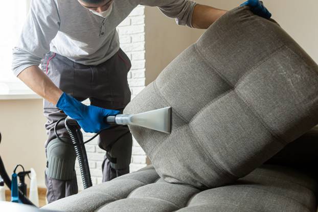 Man,Cleaning,Sofa,Chemical,Cleaning,With,Professionally,Extraction,Method.,Upholstered