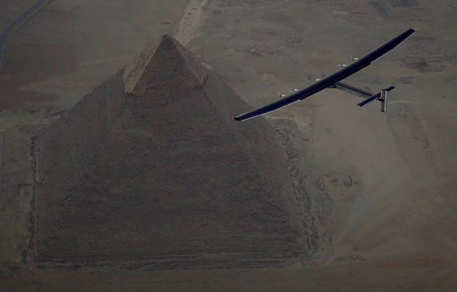 Solar Impulse 2, the solar powered plane, piloted by Swiss pioneer Andre Borschberg is seen during the flyover of the pyramids of Giza on July 13, 2016 prior to the landing in Cairo