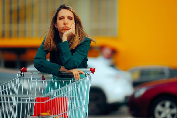 Stressed,Supermarket,Customer,Pushing,A,Shopping,Cart.,Poor,Broke,Girl