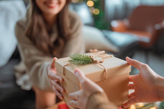 Excited,Asian,Woman,Getting,Surprise,Gift,From,Her,Girlfriend,At