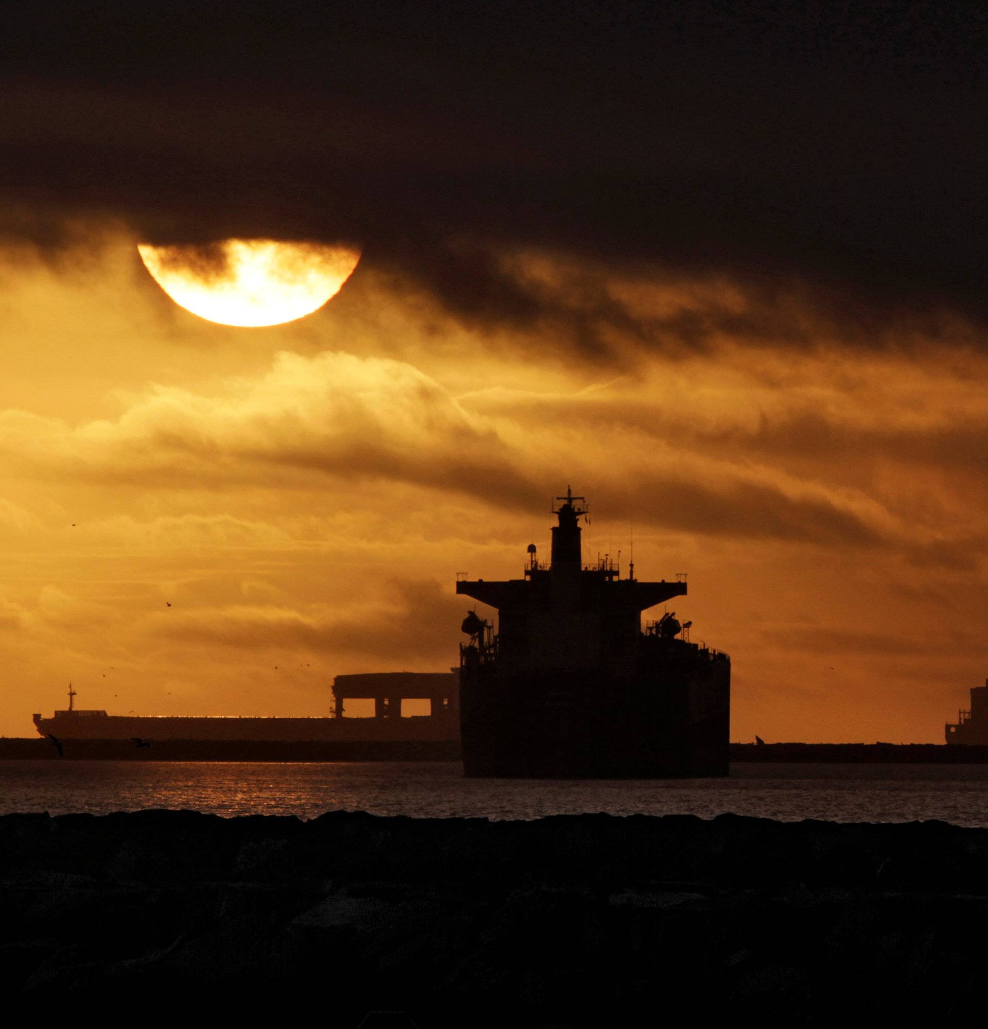 Anchored container ships and with other vessels sit offshore near the ports of Los Angeles and Long Beach during a strike