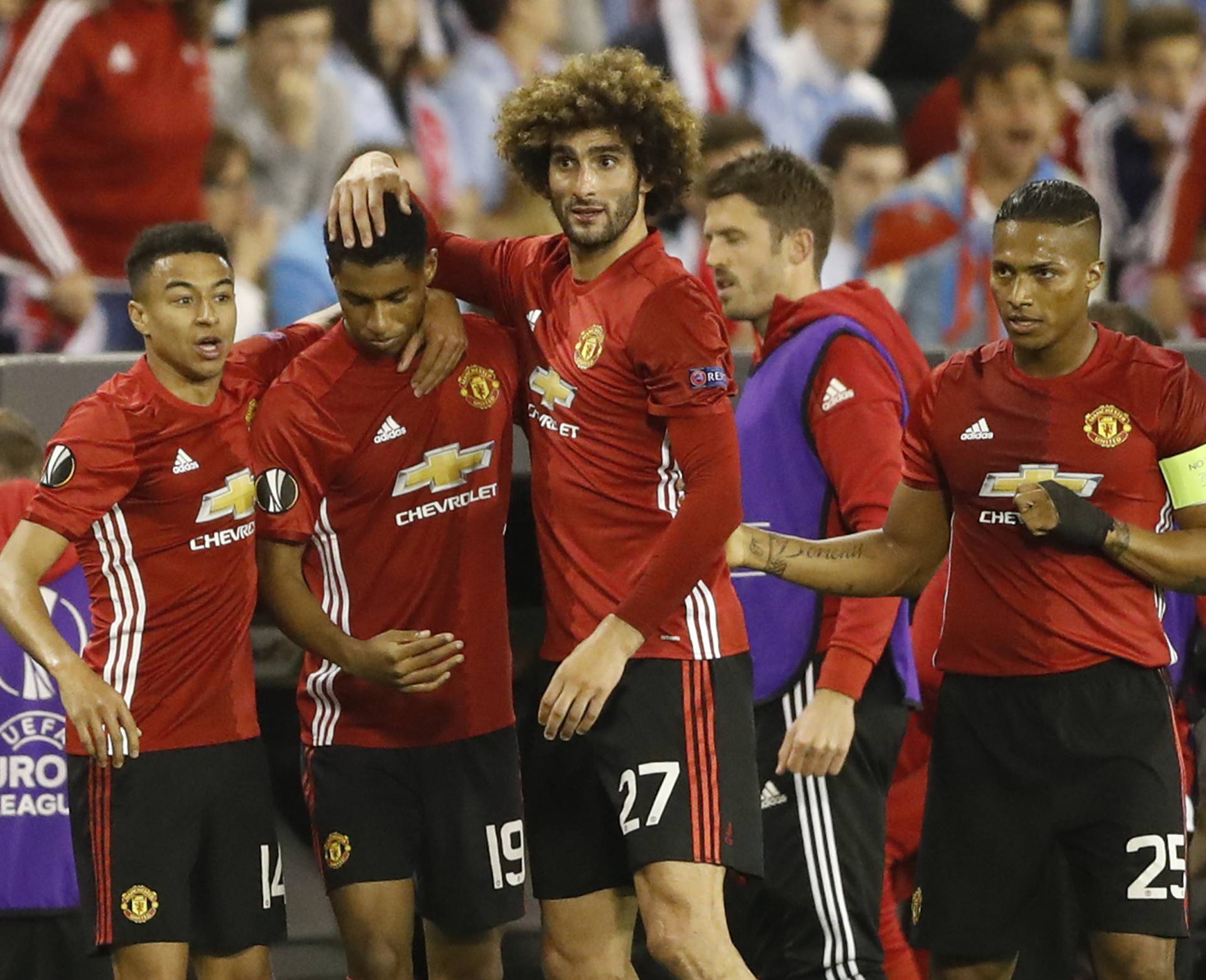 Manchester United's Marcus Rashford celebrates scoring their first goal with team mates