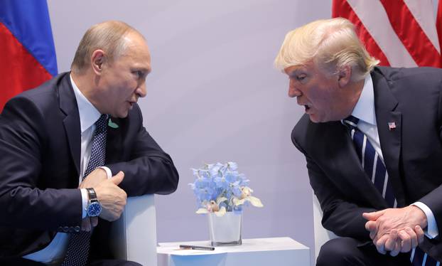 U.S. President Donald Trump speaks with Russian President Vladimir Putin during their bilateral meeting at the G20 summit in Hamburg