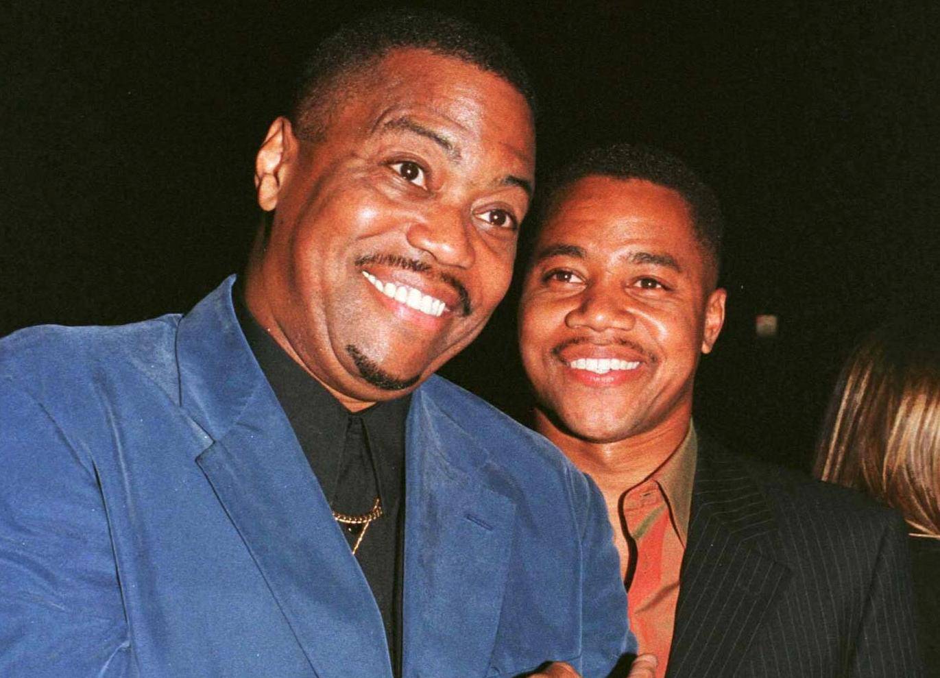 FILE PHOTO: Actor Cuba Gooding, Jr. poses with his father Cuba Gooding, Sr. as they arrive for the film's premiere in Beverly Hills