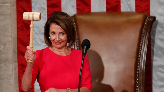 House Speaker-delegate Nancy Pelosi (D-CA) raises the gavel after being elected as House Speaker  in Washington