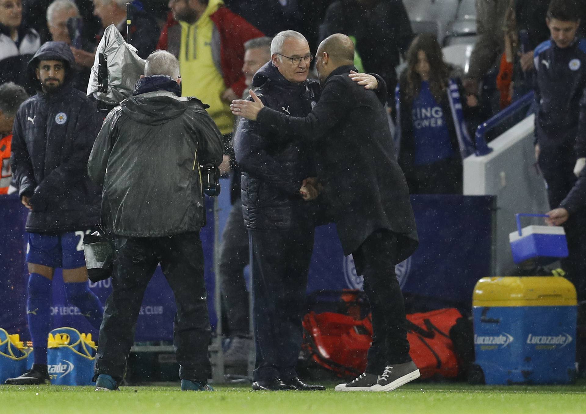 Manchester City manager Pep Guardiola and Leicester City manager Claudio Ranieri embrace at the end of the match