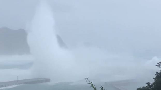 A massive wave pushed by winds is seen during Typhoon Hagibis in Kozu Island
