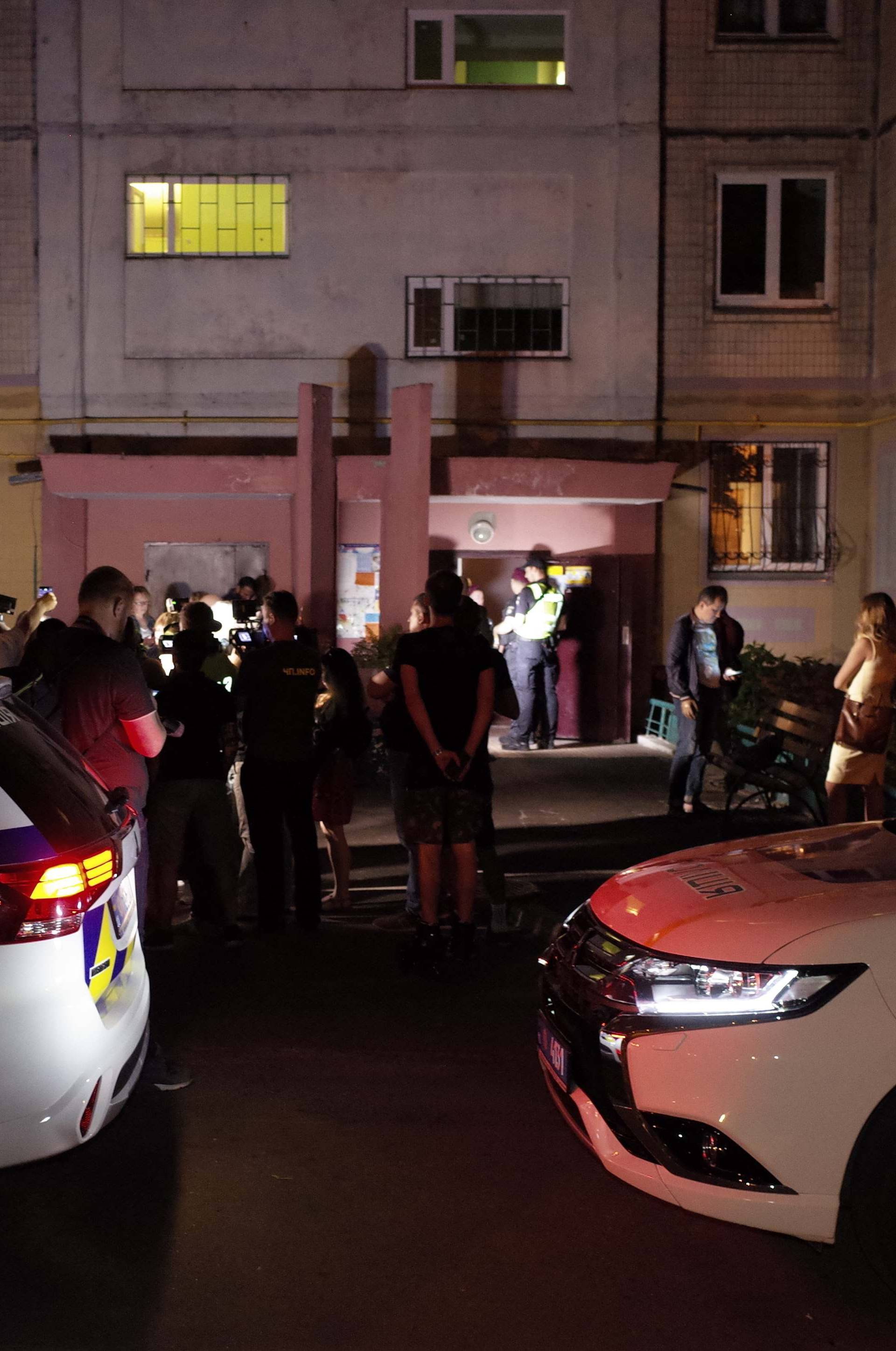 Police cars are seen parked in front of an apartment block where Russian journalist Arkady Babchenko was shot and died of his wounds in an ambulance, in Kiev