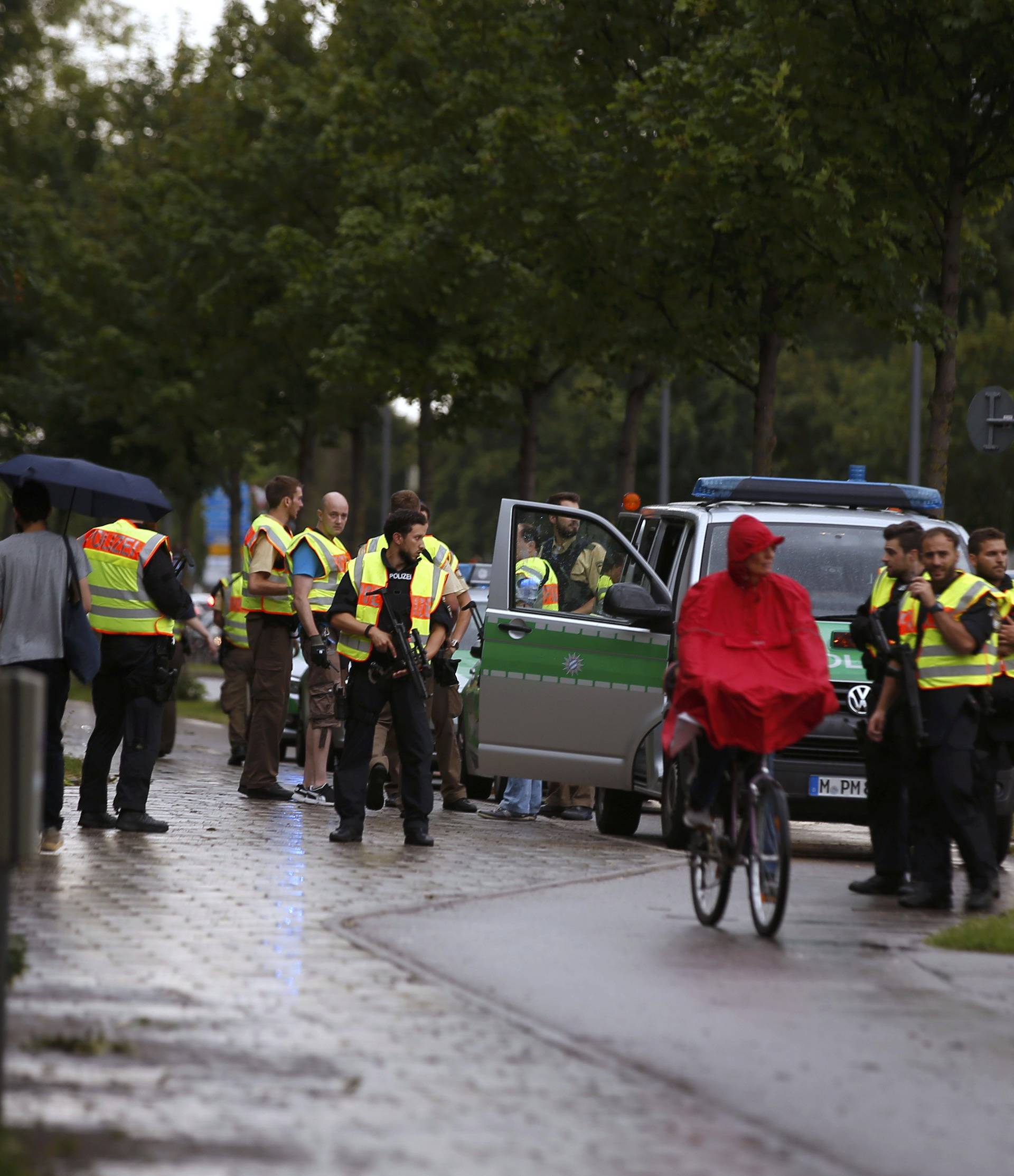 Police secure a street near to the scene of a shooting in Munich