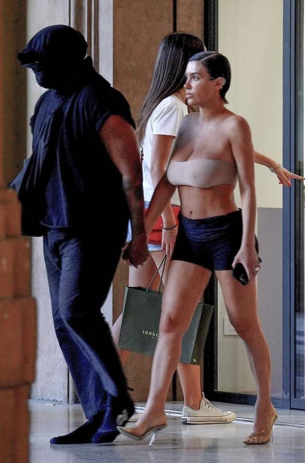 *PREMIUM-EXCLUSIVE* *MUST CALL FOR PRICING* The American Rapper Kanye West in his usual incognito mode is seen with his partner Bianca Censori as they step out of an Italian hotel for some shopping in the center of Florence.