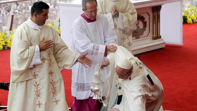 Pope Francis falls as he arrives at the Jasna Gora shrine in Czestochowa