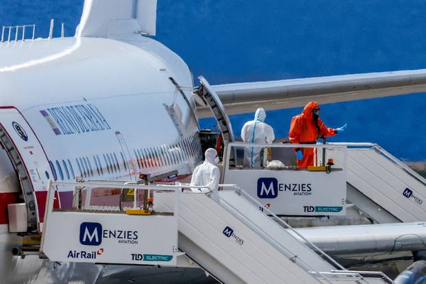 Passengers of the cruise ship MV Hondius, which was affected by a hantavirus outbreak, arrive at Tenerife Sud airport
