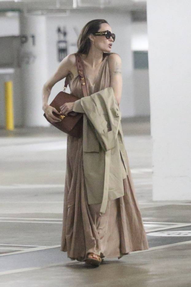 Angelina Jolie shops with her two daughters Vivian and Sahara at the Century City Mall