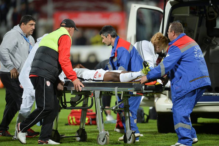 Dinamo Bucharest's Ekeng is transported to an ambulance after collapsing during a play-off match against Viitorul Constanta in Bucharest