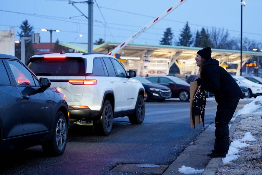 People protest against the fatal shooting of Renee Nicole Good by an ICE agent, in Minneapolis