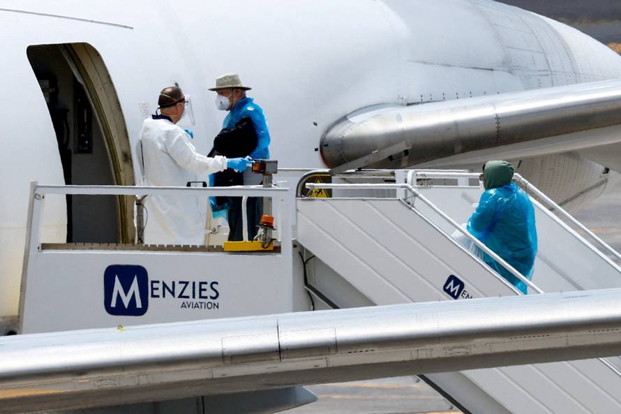 Passengers of the cruise ship MV Hondius, which was affected by a hantavirus outbreak, arrive at Tenerife Sud airport