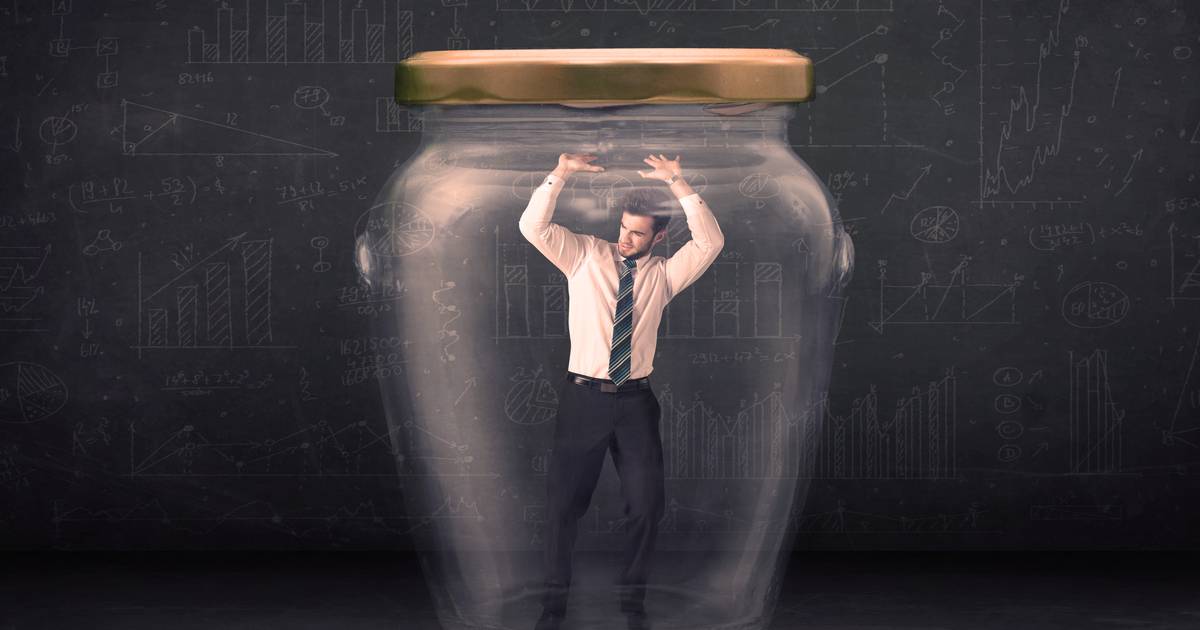 Guy Sits On Glass Jar