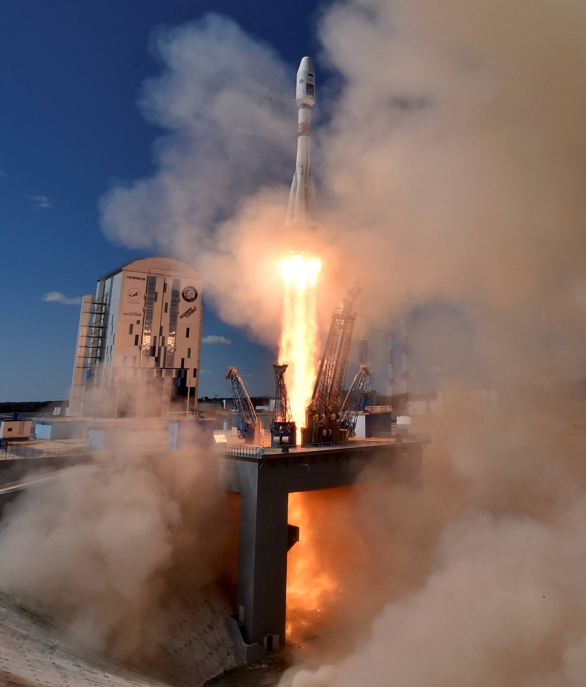 A Russian Soyuz 2.1A rocket carrying Lomonosov, Aist-2D and SamSat-218 satellites begins to lift off from the launch pad at the new Vostochny cosmodrome outside the city of Uglegorsk, about 200 kms from the city of Blagoveshchensk