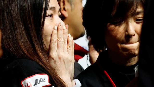 Employees of "ispace" react after the company announced they lost signal from the lander in HAKUTO-R lunar exploration program on the Moon at a venue to watch its landing in Tokyo