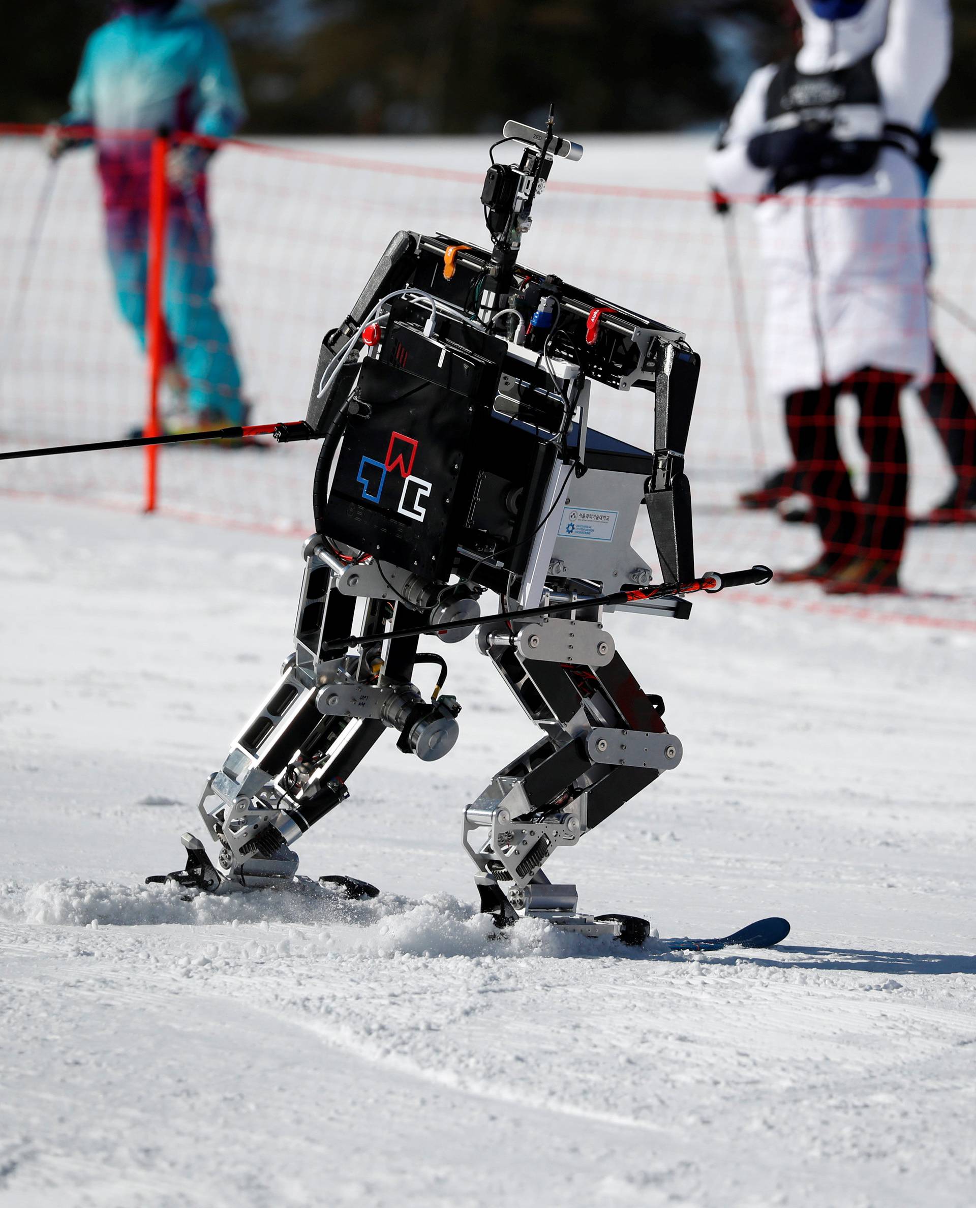 Robot Rudolph skies during the Ski Robot Challenge at a ski resort in Hoenseong