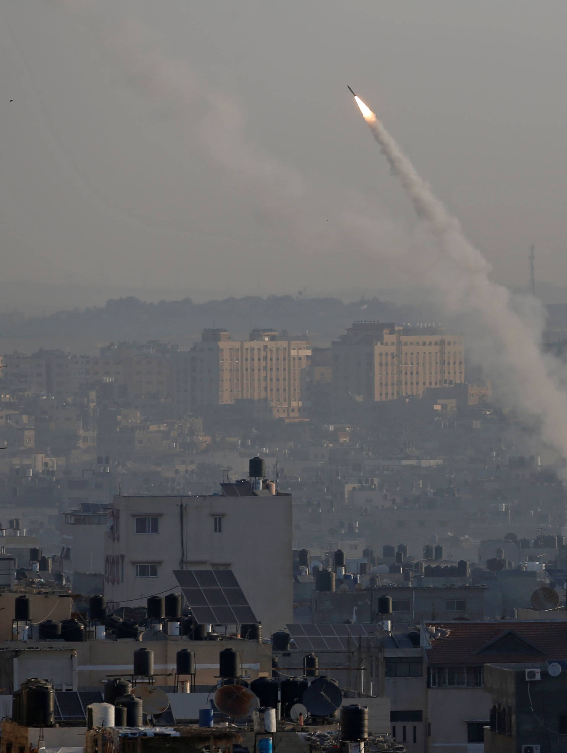 Rocket is fired from Gaza towards Israel, in Gaza