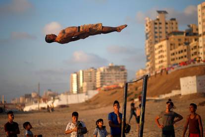 Palestinians demonstrate their parkour and street workout skills as COVID-19 restrictions ease in Gaza City