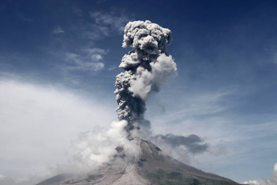 Mount Sinabung volcano, active since 2010, spews smoke and ash into the air during an eruption as seen from Sukandebi village, Karo, North Sumatra