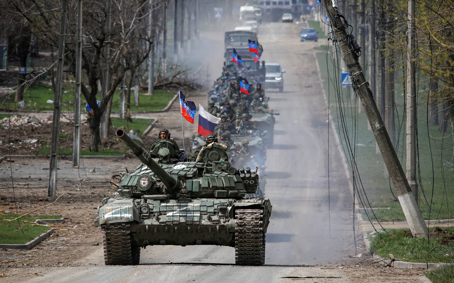 FILE PHOTO: An armoured convoy of pro-Russian troops moves along a road in Mariupol