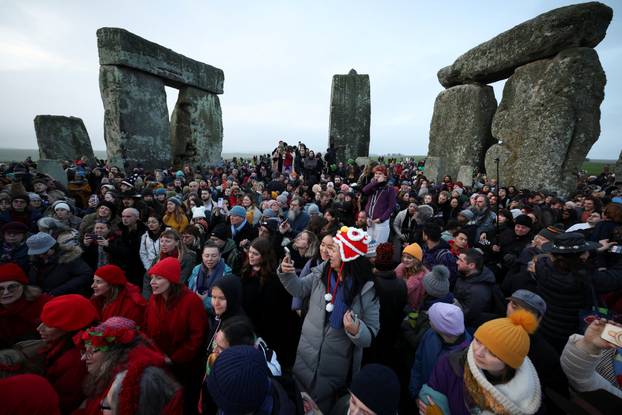 Winter solstice celebrations during sunrise at Stonehenge