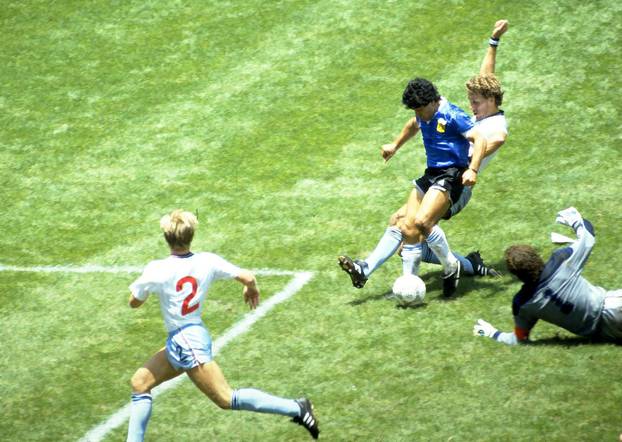 FILE PHOTO: Diego Maradona scores for Argentina