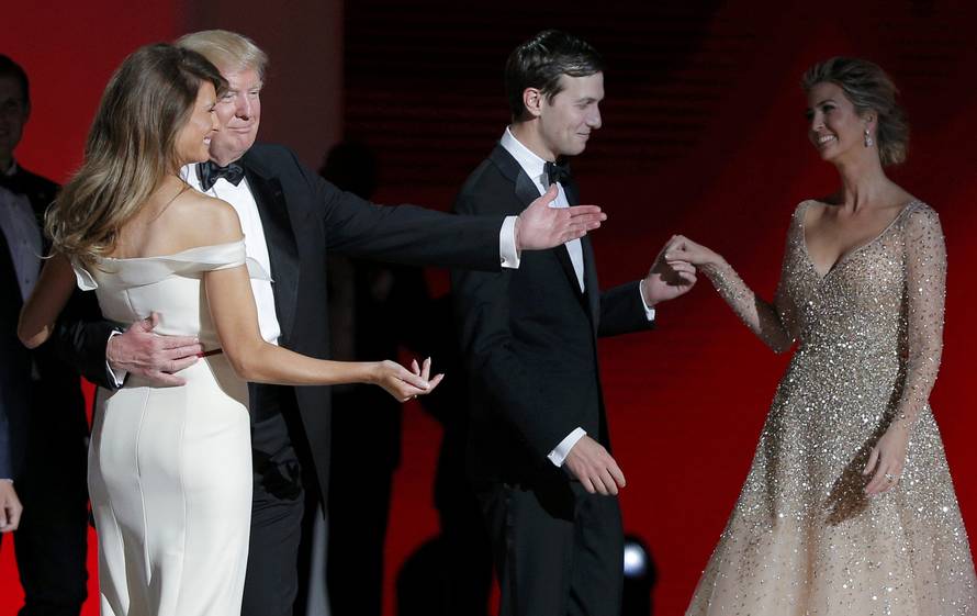 U.S. President Donald Trump and his wife first lady Melania Trump gesture towards his daughter Ivanka and her husband Jared Kushner at his "Liberty" Inaugural Ball in Washington