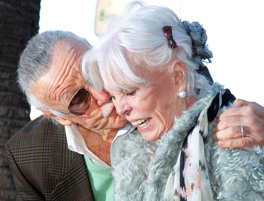 FILE PHOTO - Comic book creator Stan Lee kisses his wife Joan after she walked across his newly unveiled star on the Hollywood Walk of Fame in Hollywood