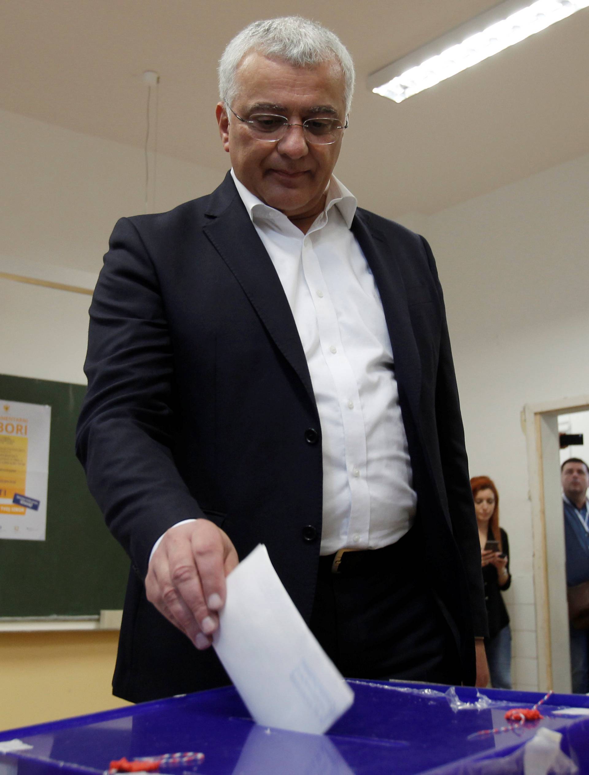 Andrija Mandic, leader of opposition Democratic Front alliance, casts his ballot at a polling station in Podgorica