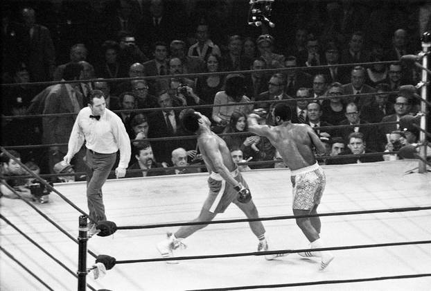  Joe Frazier (R) lands a left hook on Muhammad Ali during the first of their three epic battles at Madison Square Garden in New York City