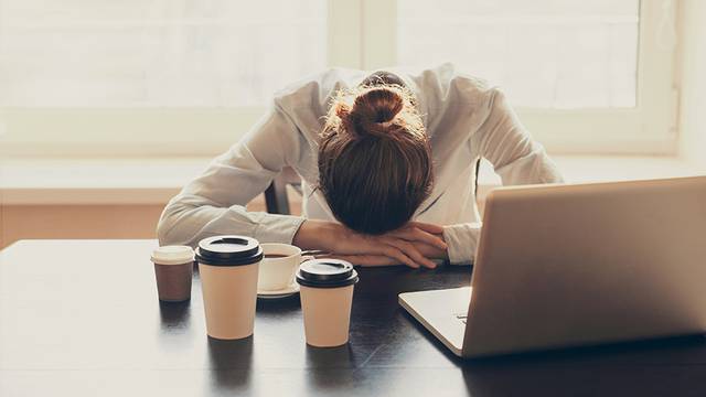 Tired woman in the office