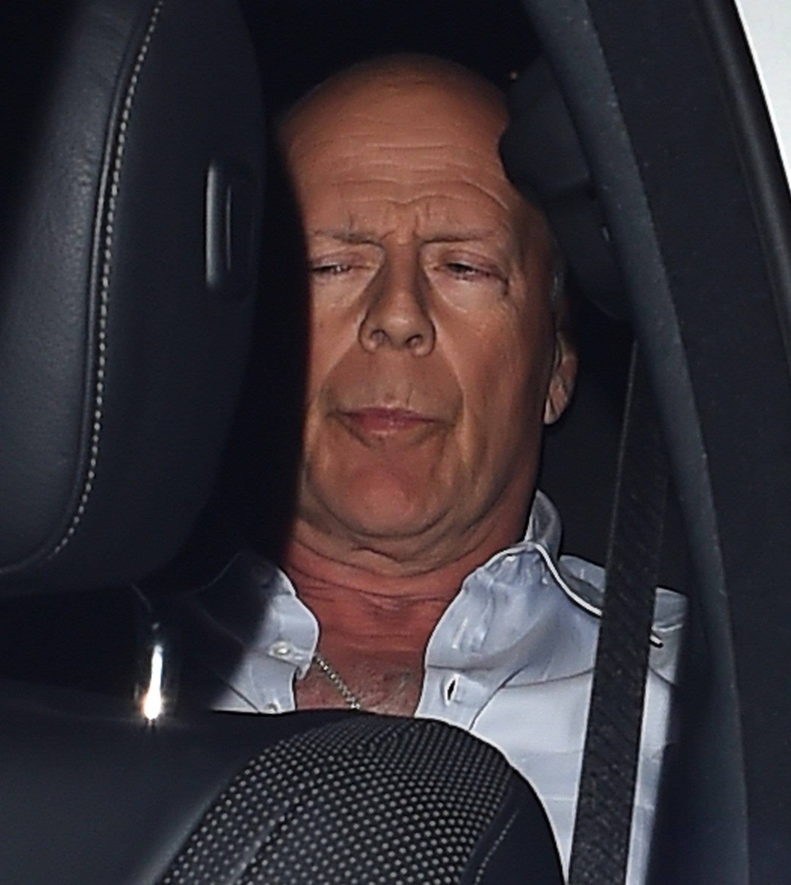 Bruce Willis is aided out of Annabel's Member's Club in London