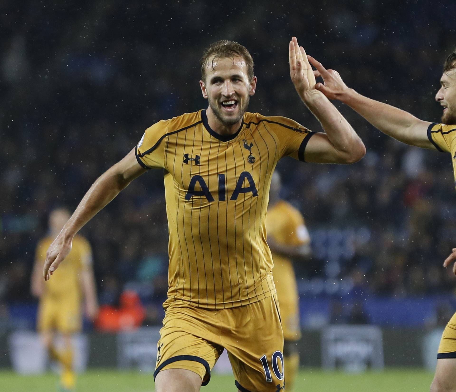 Tottenham's Harry Kane celebrates scoring their fifth goal  to complete his hat trick with Filip Lesniak