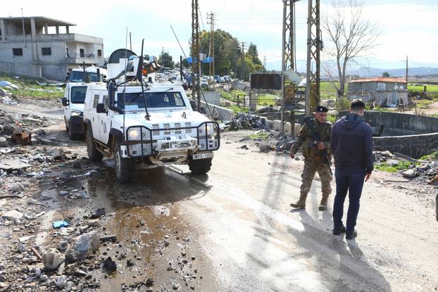 A UNIFIL vehicle drives as residents who were displaced because of the hostilities between Hezbollah and Israel return to the Lebanese village of Khiam