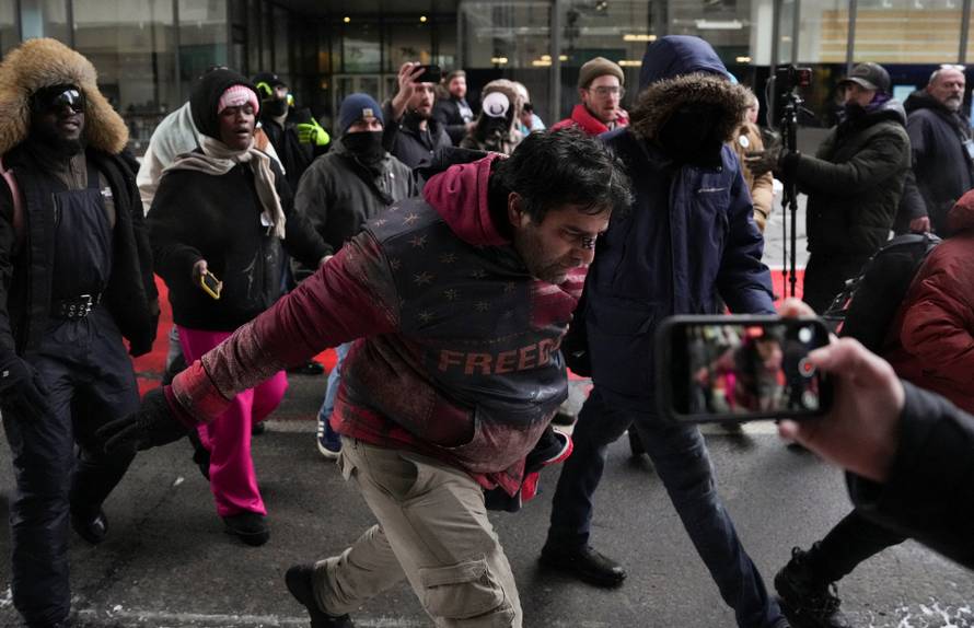 People attend the "March Against Minnesota Fraud" in Minneapolis