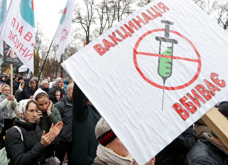 People attend a rally against coronavirus disease (COVID-19) restrictions in Kyiv