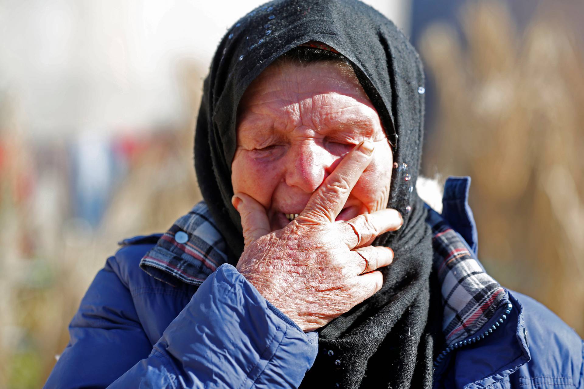 Gamra, the mother of Brahim Aouissaoui, who is suspected of carrying out Thursday's attack in Nice, France, reacts at her home in Thina, a suburb of Sfax, Tunisia