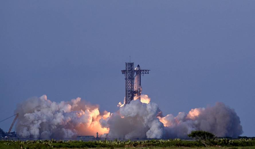 A SpaceX Super Heavy booster carrying the Starship spacecraft lifts off on its 10th test flight