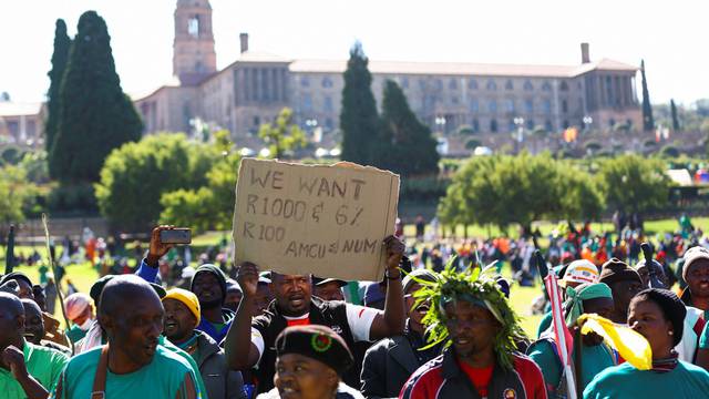Mine workers protest outside government's offices,  in Pretoria