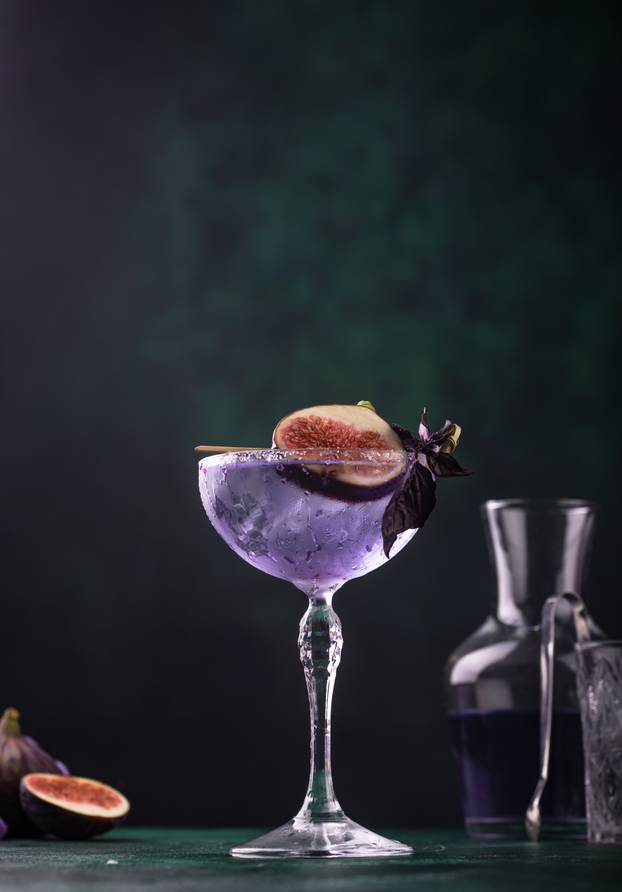Purple fig cocktail or mocktail in glass