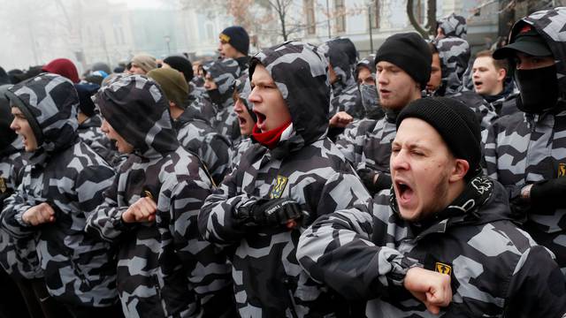 Activists of far-right parties shout slogans during a rally to support the Ukrainian navy after Russia seized two Ukrainian armored artillery vessels and a tug boat in the Black Sea, in front of the presidential administration headquarters in Kiev