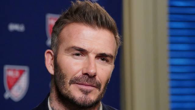 FILE PHOTO: Former soccer player and MLS team owner David Beckham speaks during an interview in the Manhattan borough of New York City